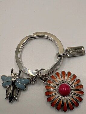 Coach Silver Key Ring with Orange Daisy and Light Blue Dragonfly Charms NWOT